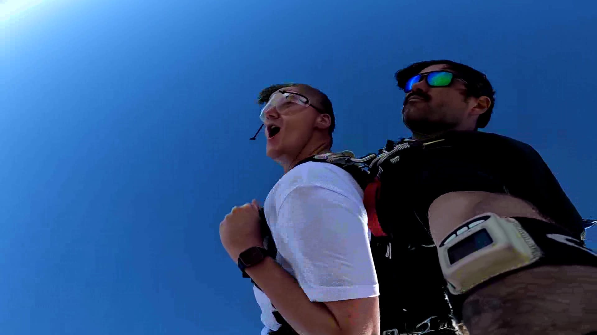 MSIG commercial insurance agent, Brendan Dooley, screaming in excitement while skydiving in business clothes.