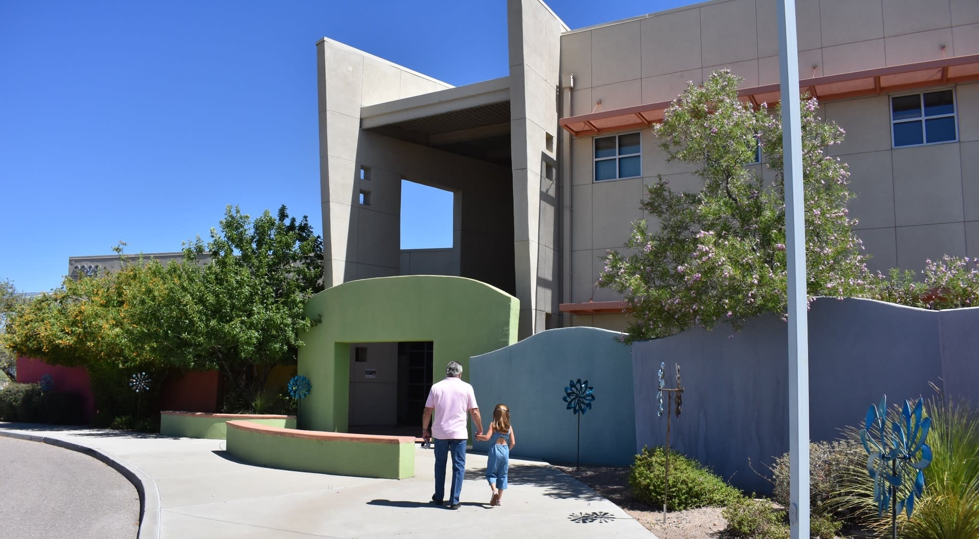 FatherAndChildEnteringBuilding