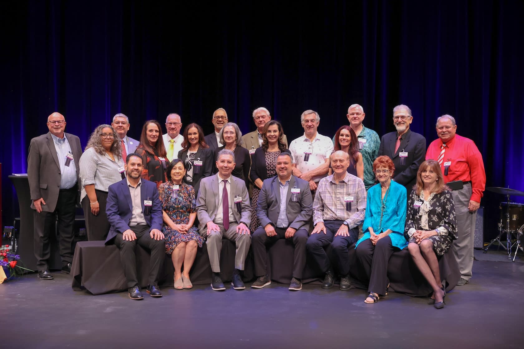 Large group of people posing on stage for the Hall of Fame Event