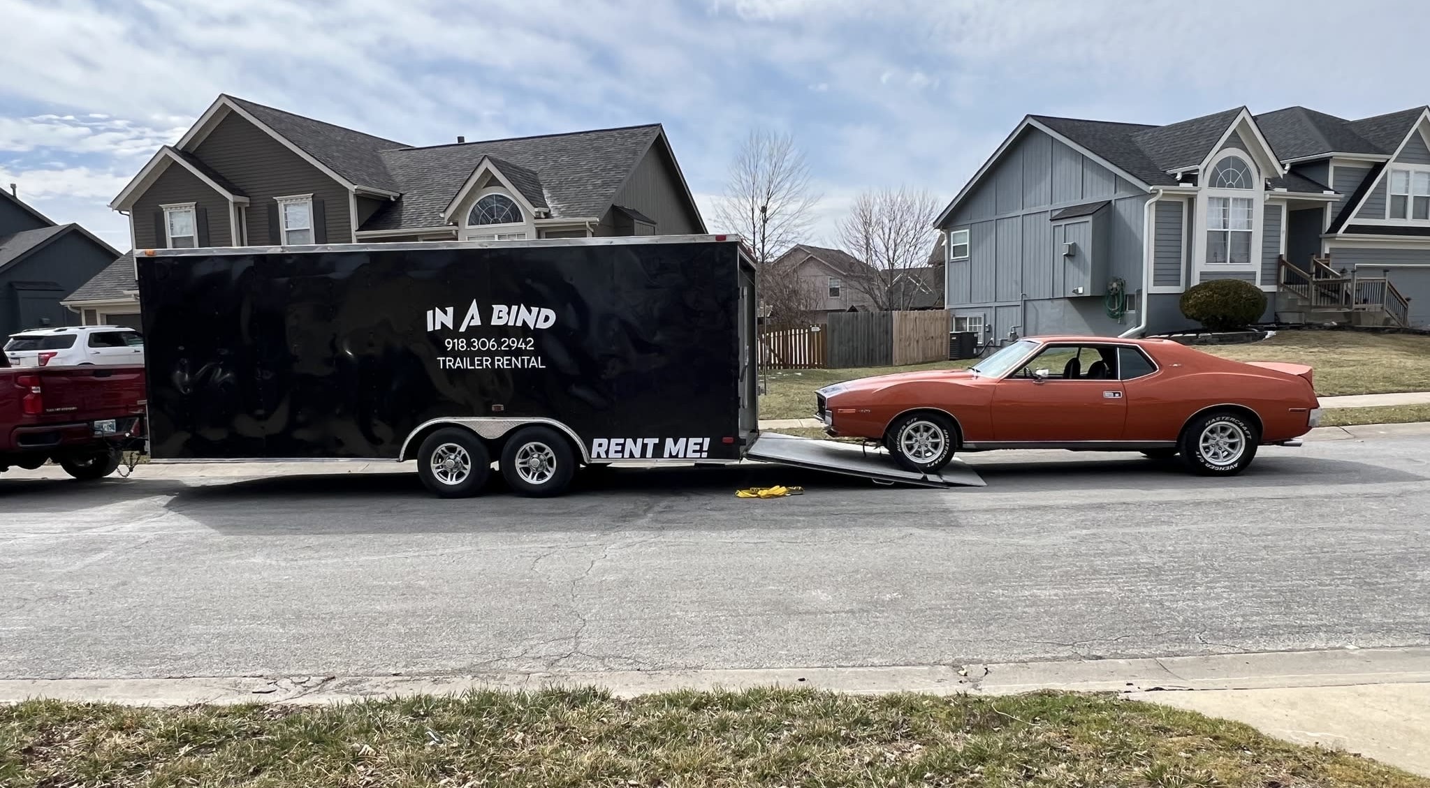 In A Bind Enclosed Trailer with Classic Car being loaded up