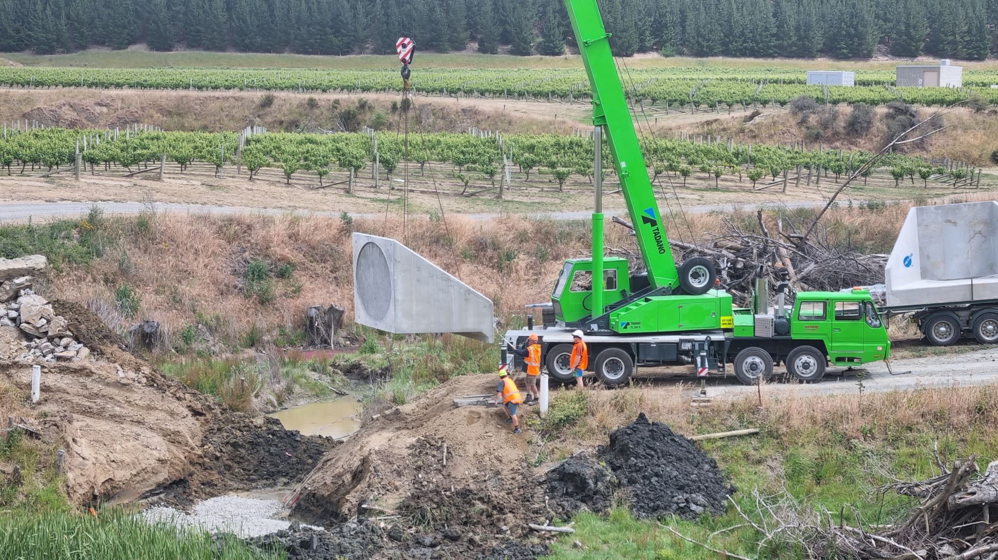 we replaced an old culvert with sturdy concrete wingwalls and robust 1800-diameter concrete pipes, weighing in at over 30 ton