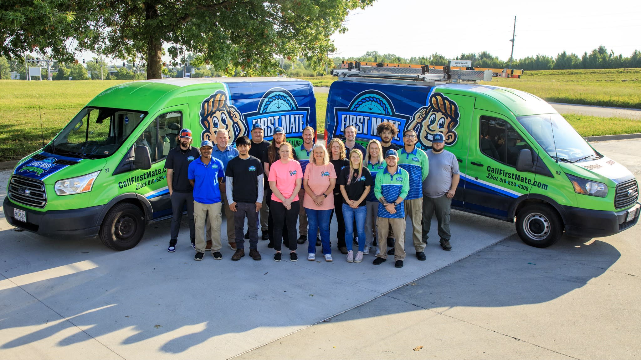 First Mate Heating & Cooling team with branded service vehicles, representing a family-owned HVAC company serving Leawood