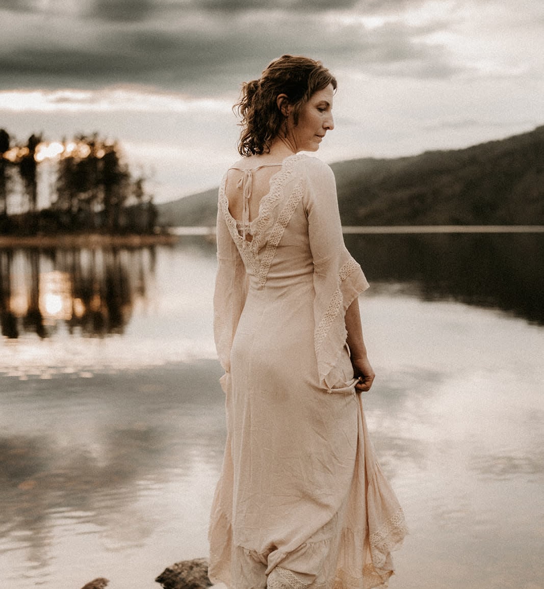 woman standing in a lake in Colorado