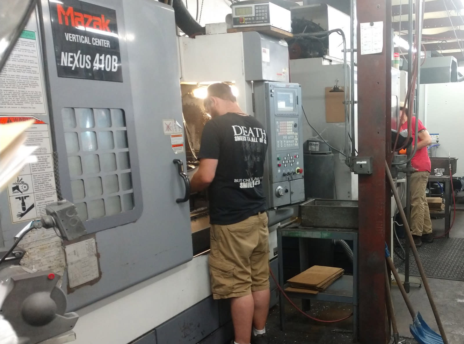 Employees monitor machines at Graphicast. The Jaffrey-based manufacturer develops and uses graphite mold casting technology t