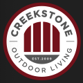 Custom outdoor living space by Creekstone Outdoor Living featuring patios, outdoor kitchens, fire pits, & landscaping.