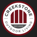Custom outdoor living space by Creekstone Outdoor Living in featuring patios, outdoor kitchens, fire pits, & landscaping.