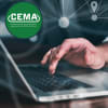 male hand on a laptop keyboard with CEMA logo