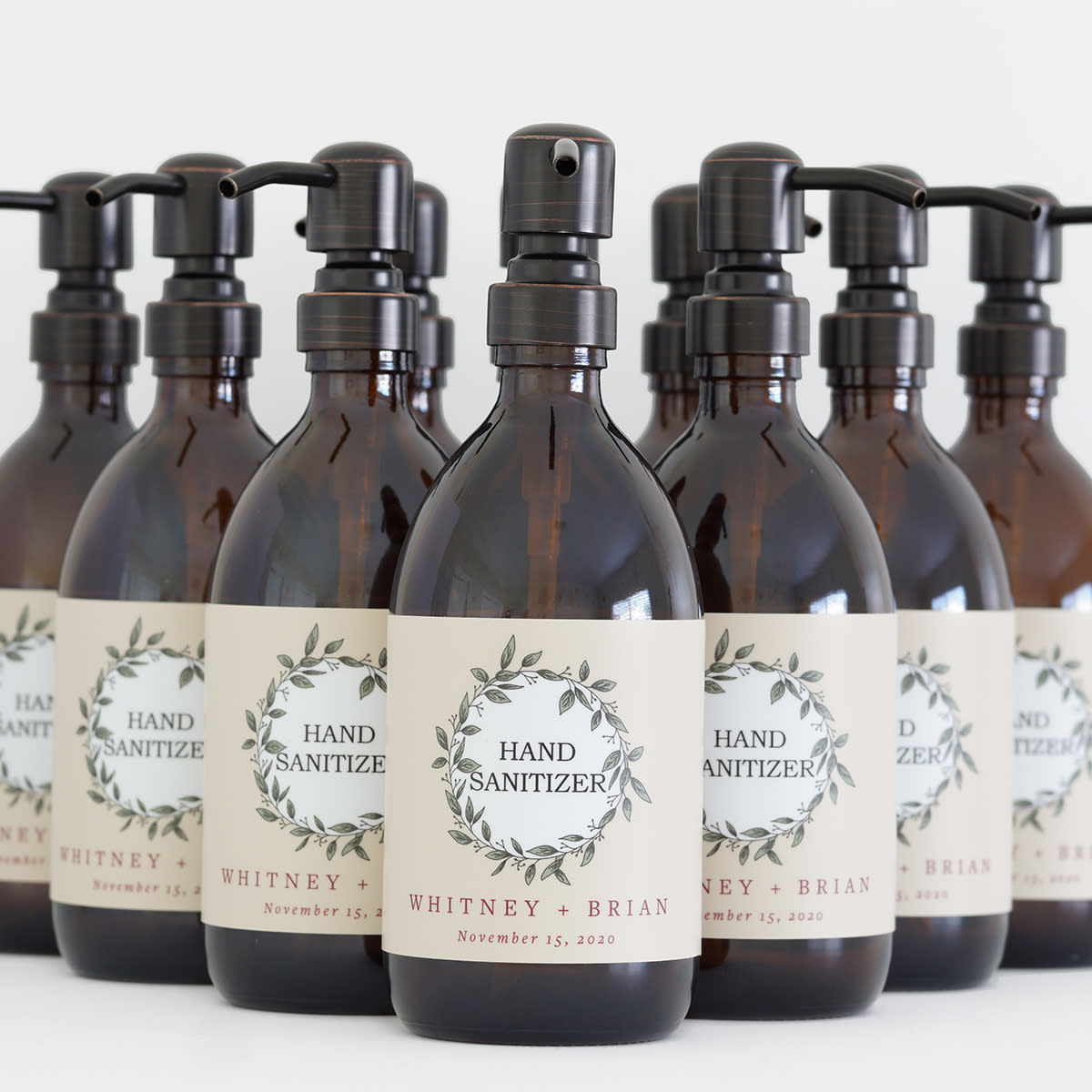 several hand sanitizer bottles for a wedding
