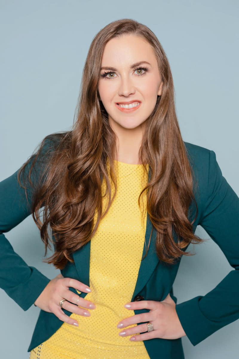 Headshot of woman in green blazer with yellow dress - Laquel Wright Photography