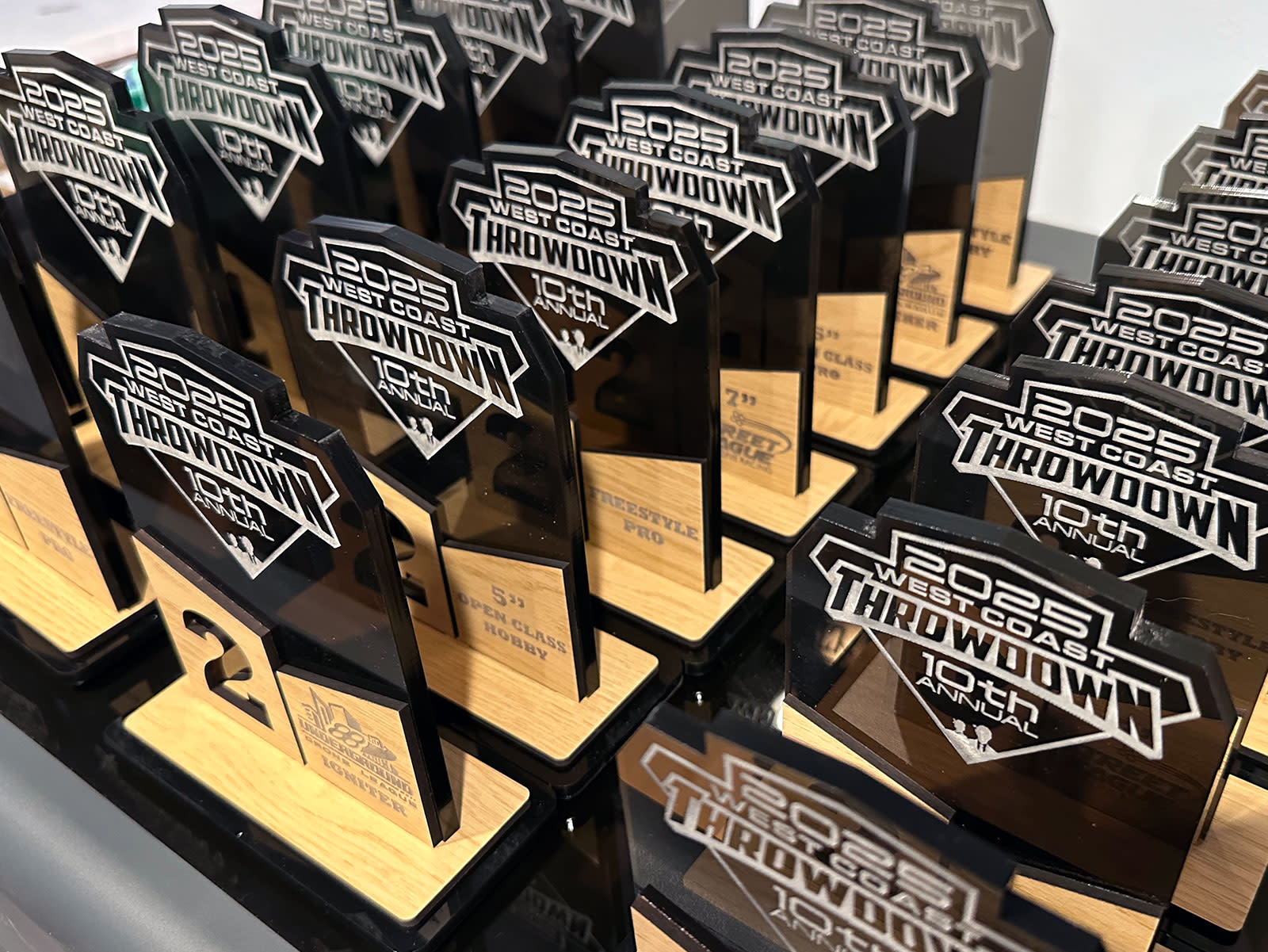 Acrylic and wood laser cut and engraved trophies manufactured by 2 Nerds LLC