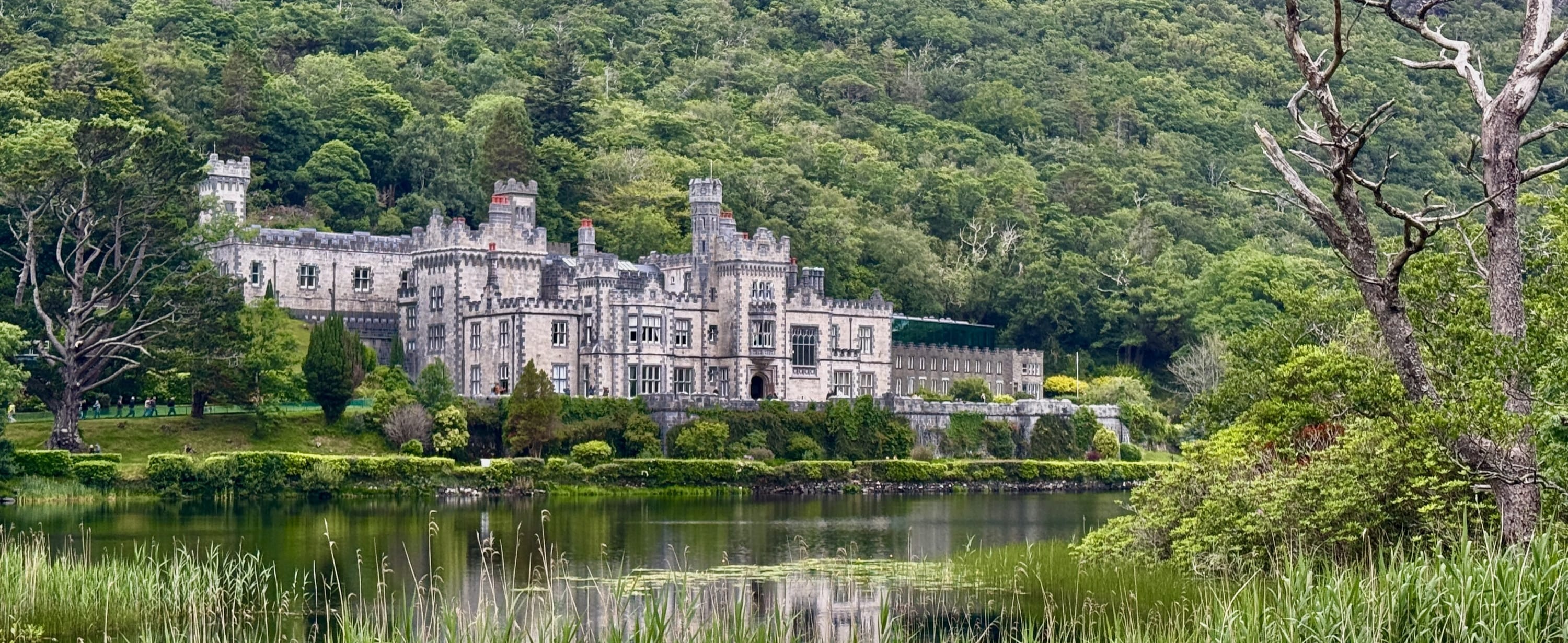 Kylemore Abbey viewed across a lake in Ireland