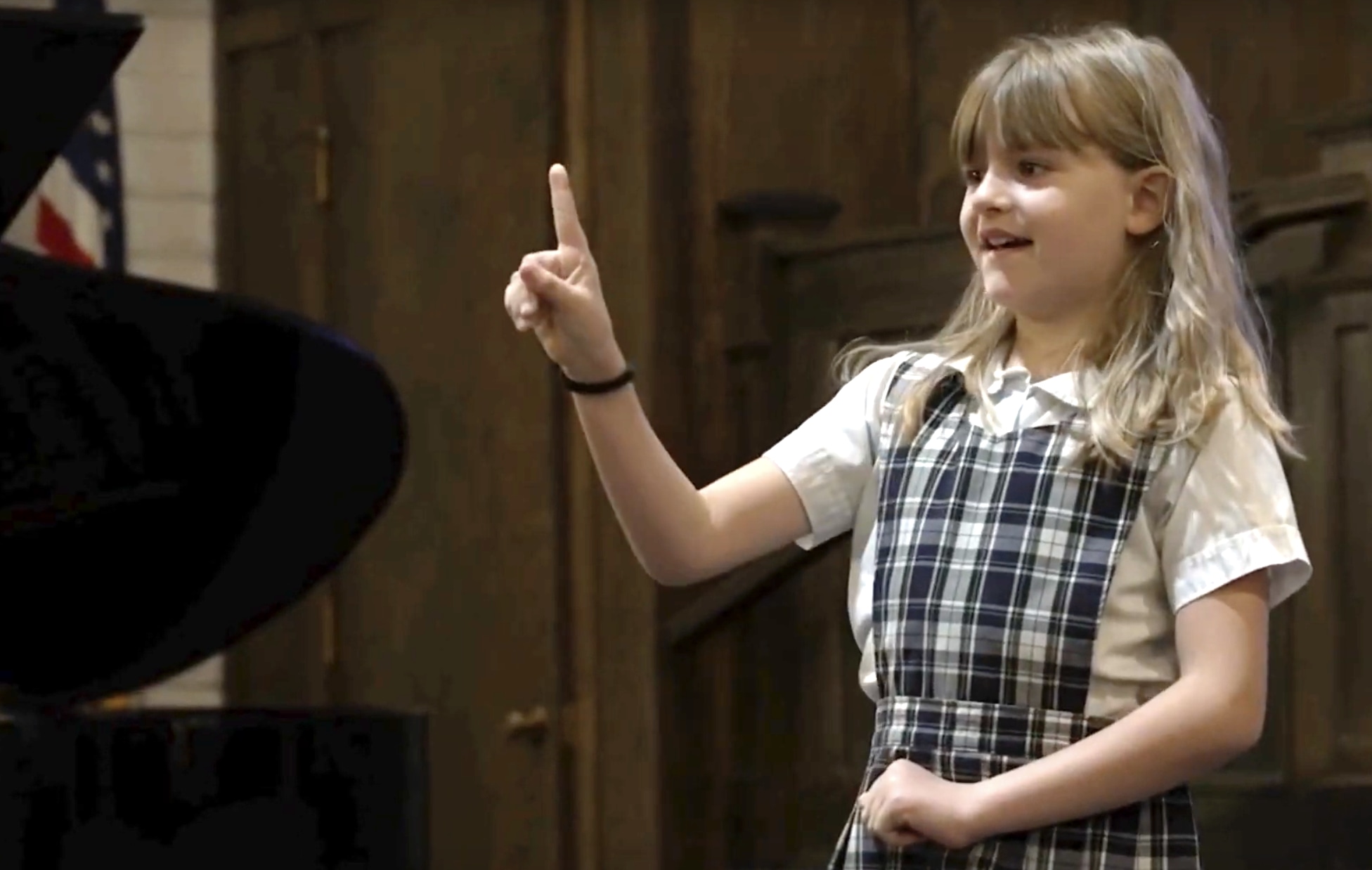 Student Presenting Class Project To School During Weekly Chapel