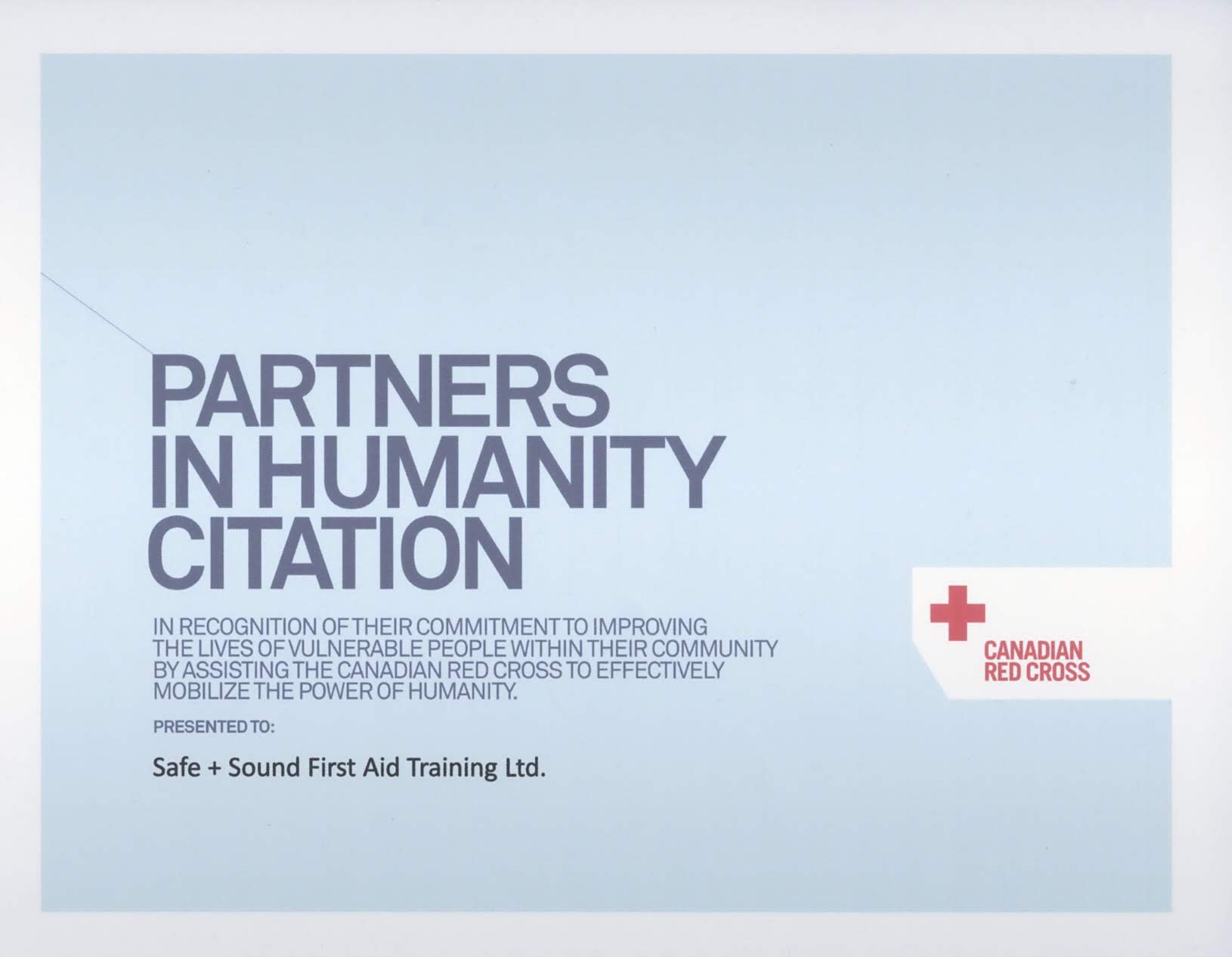 A plaque awarded to Safe + Sound First Aid Training - recipients of the Canadian Red Cross Partners in Humanity Citation.