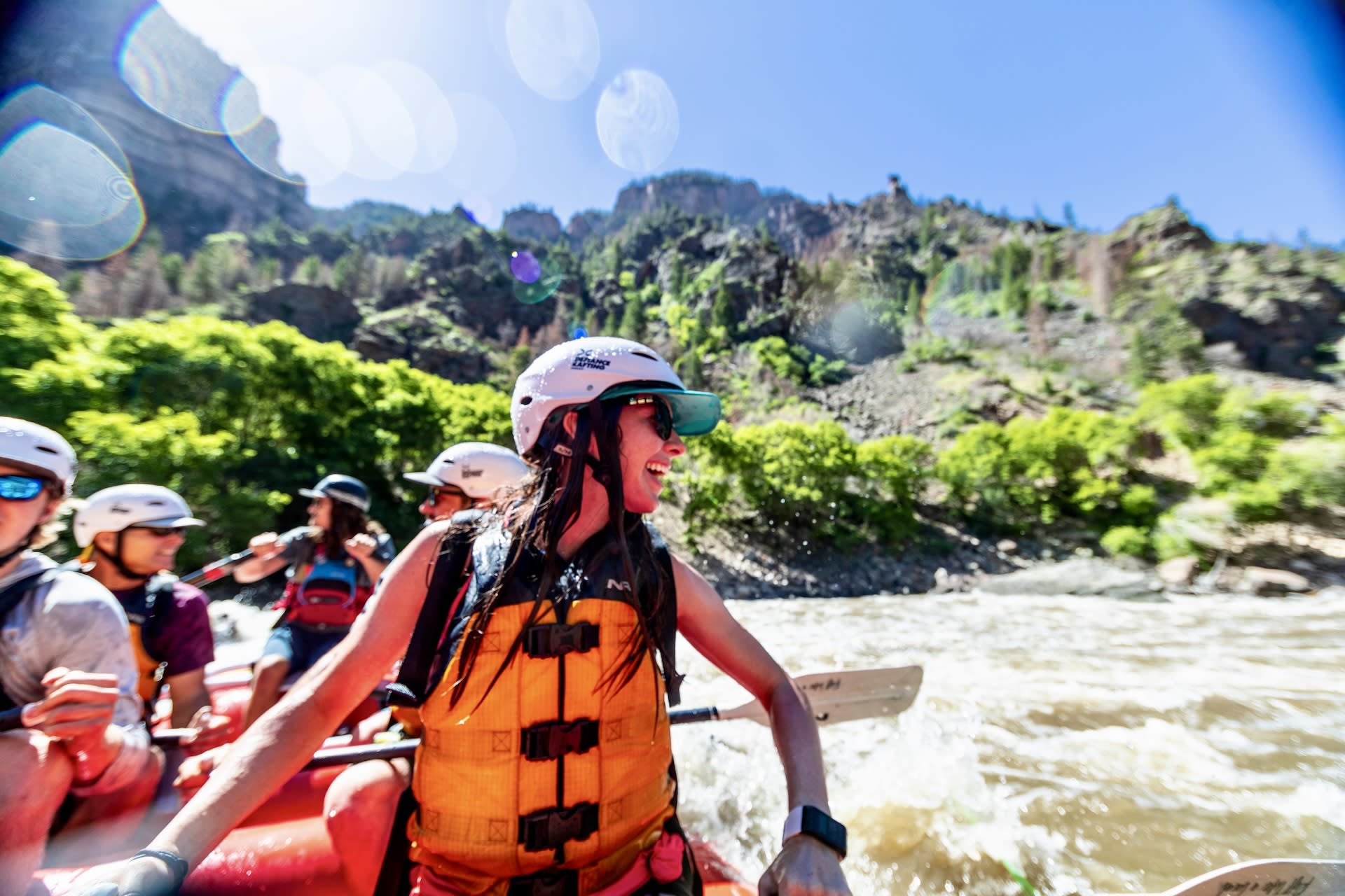 a woman looking at the next rapid in the Shoshone Rapids in Glenwood Canyon