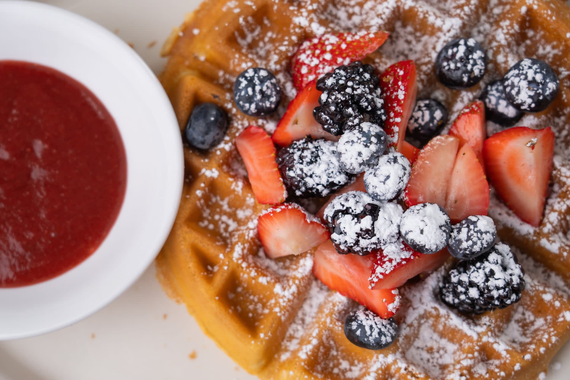 Fresh berry waffle at Miley’s Cafe in the Village of Oak Creek topped with strawberries, blueberries, blackberries