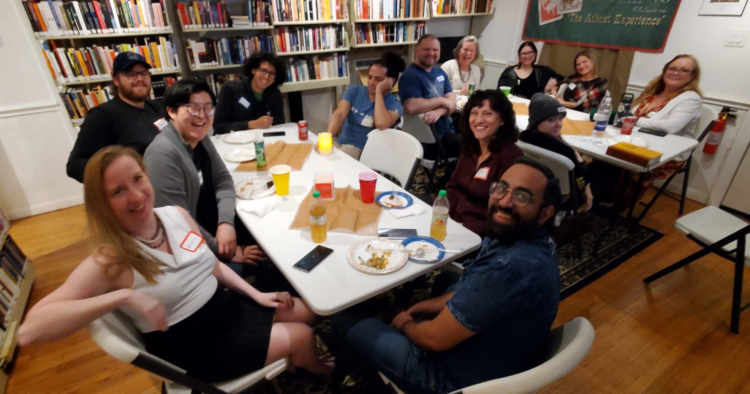 people gathered for a "friends giving" meal at the Freethought Library