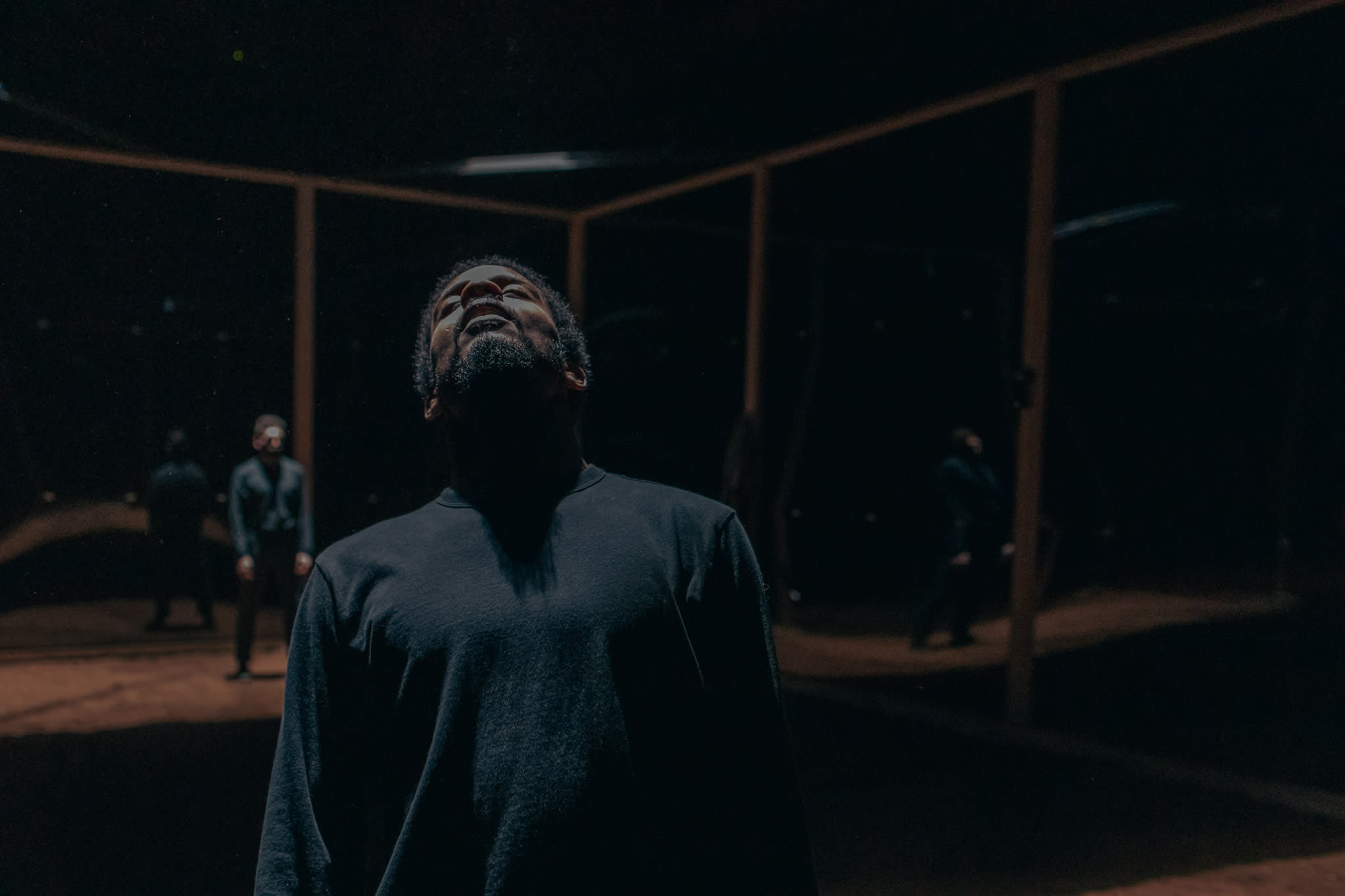 We see dancer from waist up with head tilted back