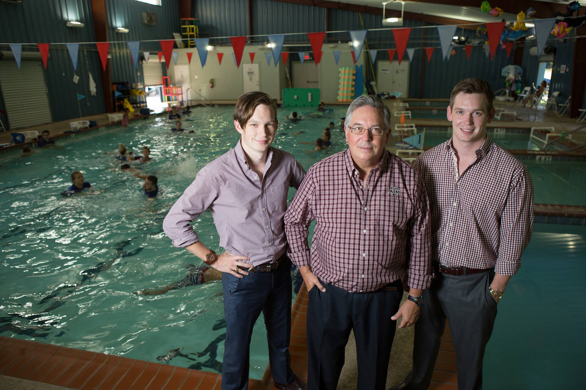 Texas Swim instructor teaching a children  water safety, survival skills, & swimming techniques in a safe indoor pool.