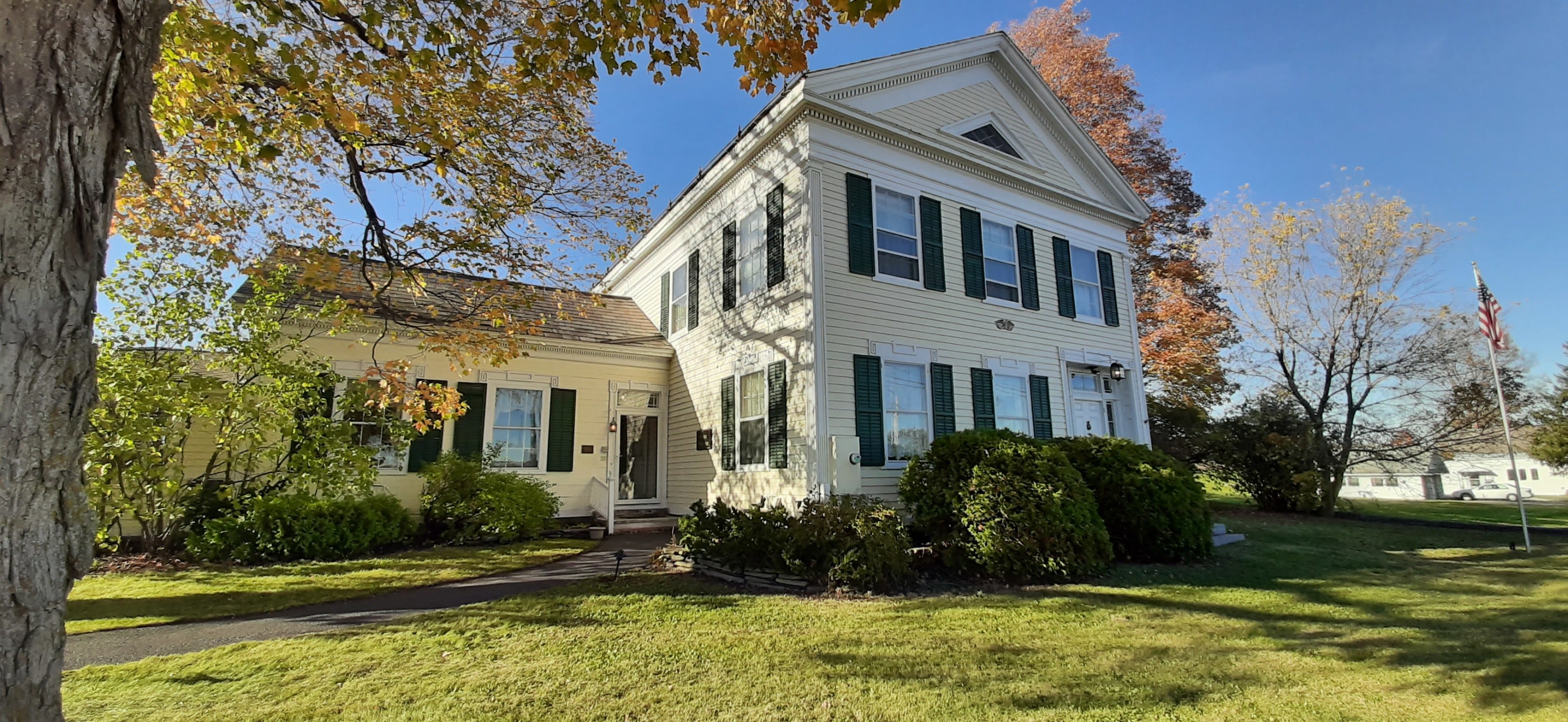 Federal Style Building with Yellow paint and Green Shutters