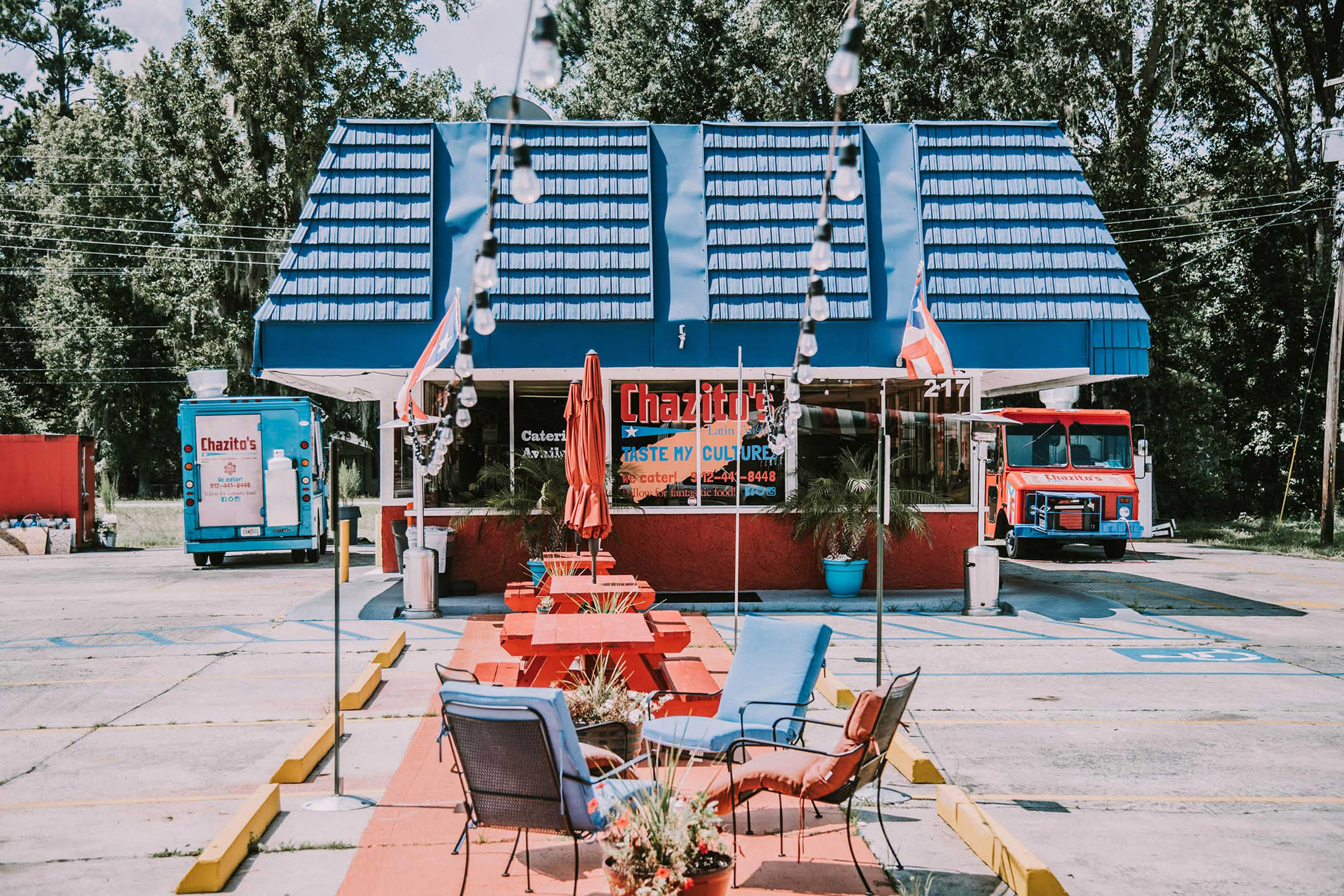 The colorful facade of Chazito's Latin Cuisine with a food truck parked beside it.