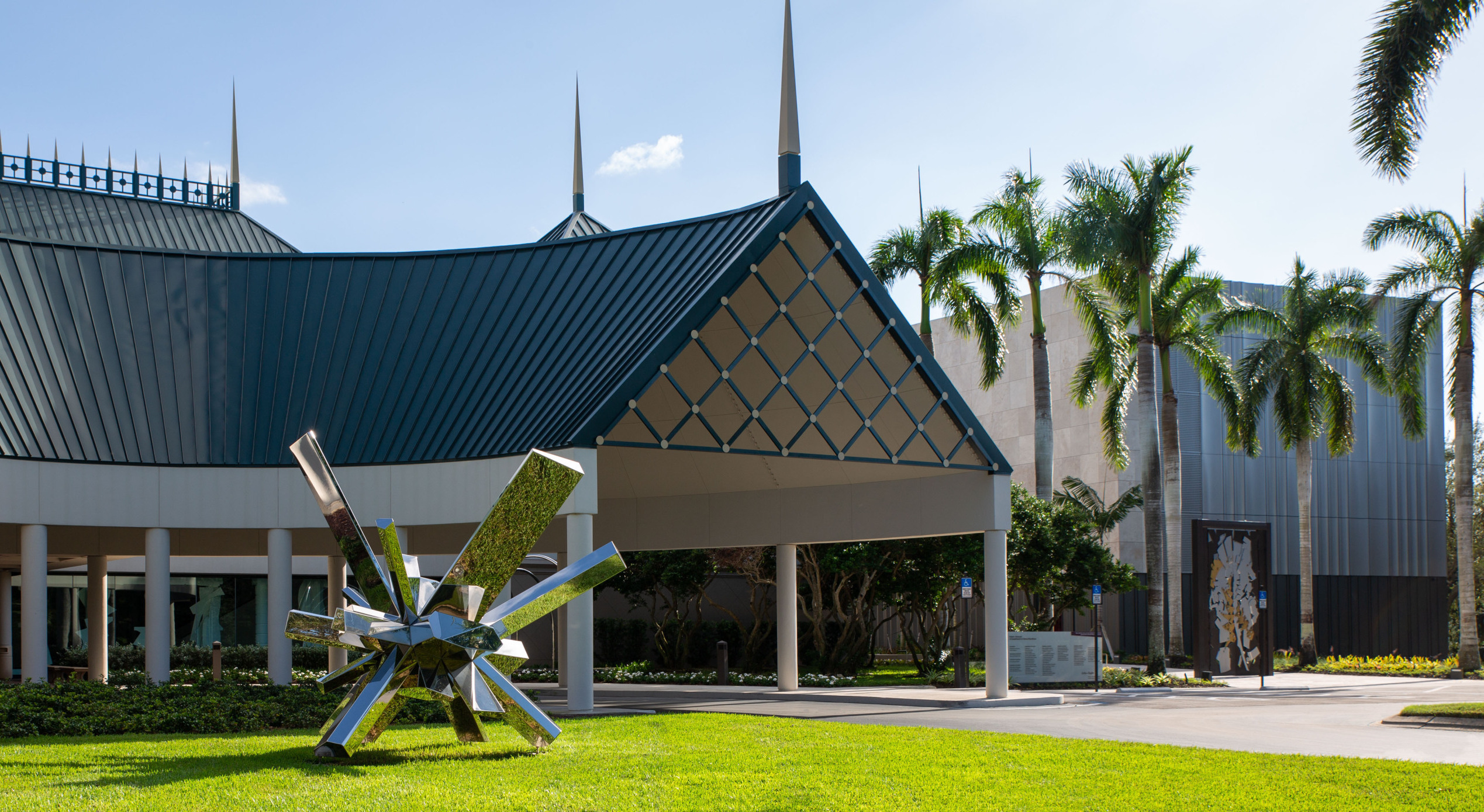 An image of the front of Hayes Hall (exterior) and The Baker Museum on a sunny day in Naples, Florida