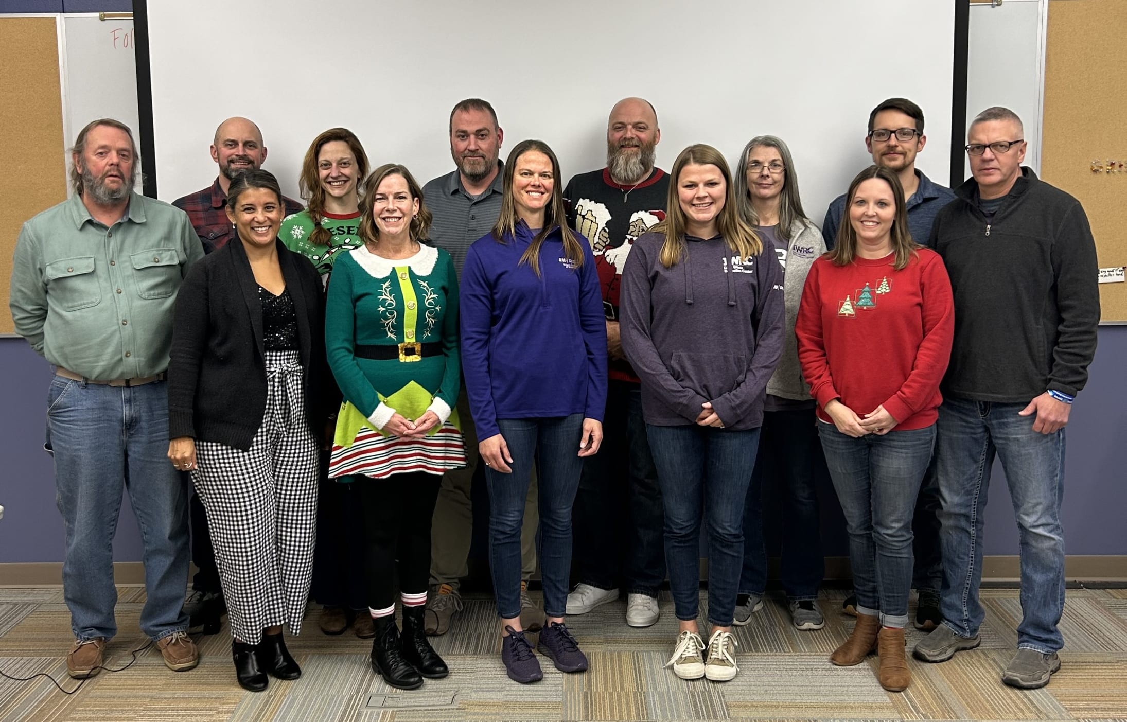 group of people posing for a group photo