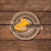Logo for Wolfe's Exotic Encounters featuring a bright yellow bearded dragon and a ball python on a wooden background