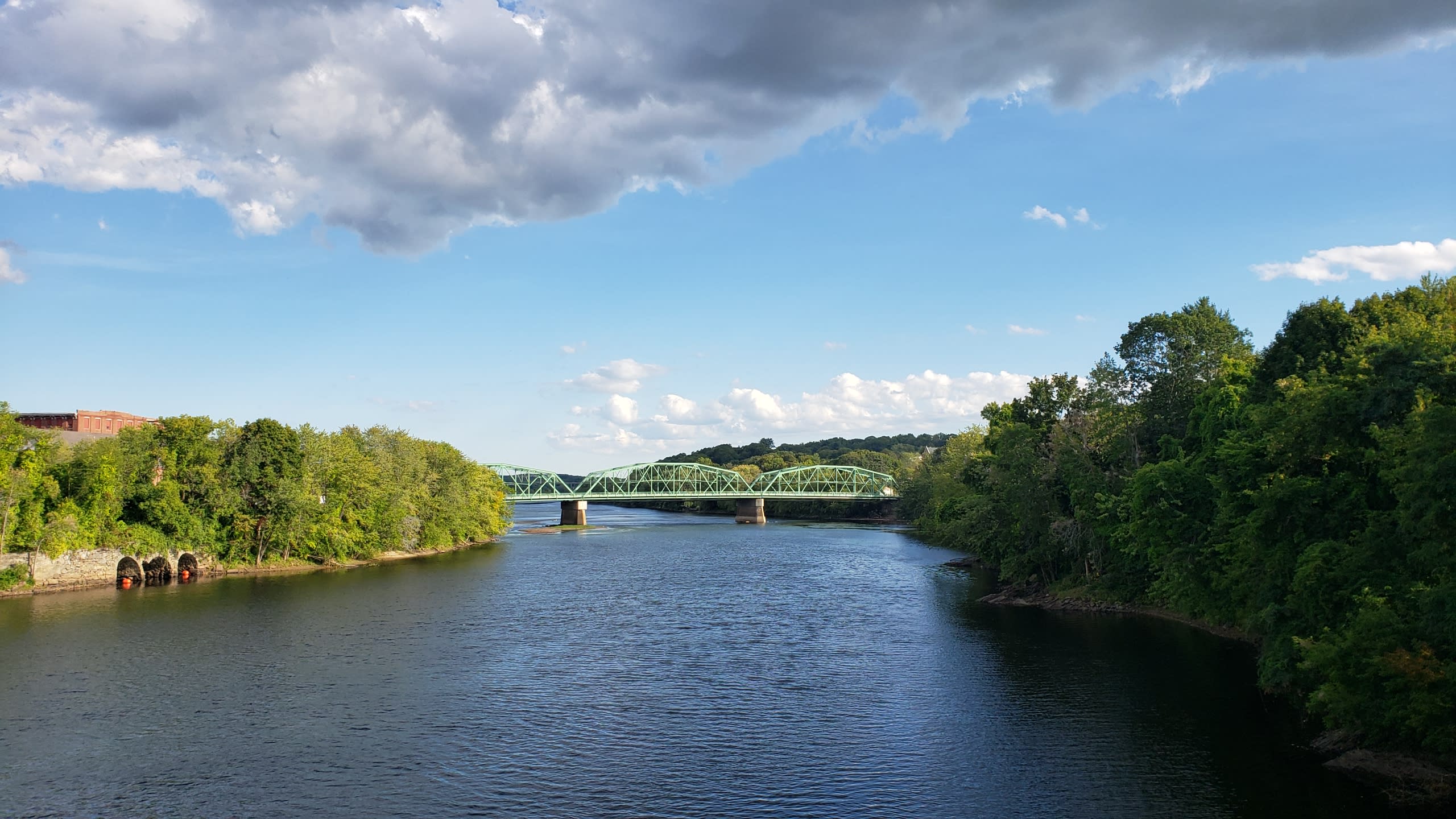 Photo of Androscoggin River from above with a view of a bridge