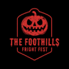 Red evil pumpkin on a black background with words "The Foothills Fright Fest" below