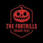 Red evil pumpkin on a black background with words "The Foothills Fright Fest" below