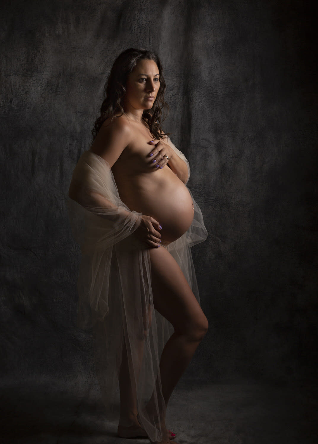 Maternity Portrait. Implied nude. Draped in Ivory Tulle