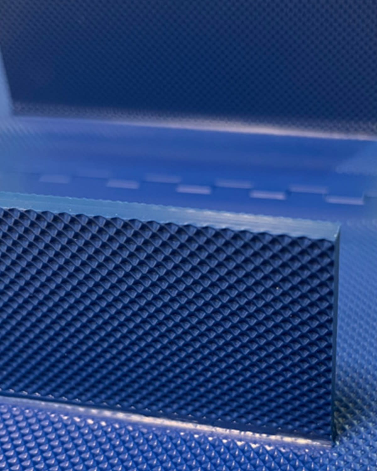 Cleat and belt with inverted pyramid surface
