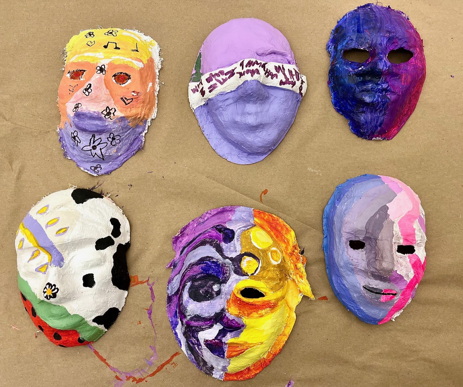 A series of six masks made by our expressive arts therapy students to express personal identity