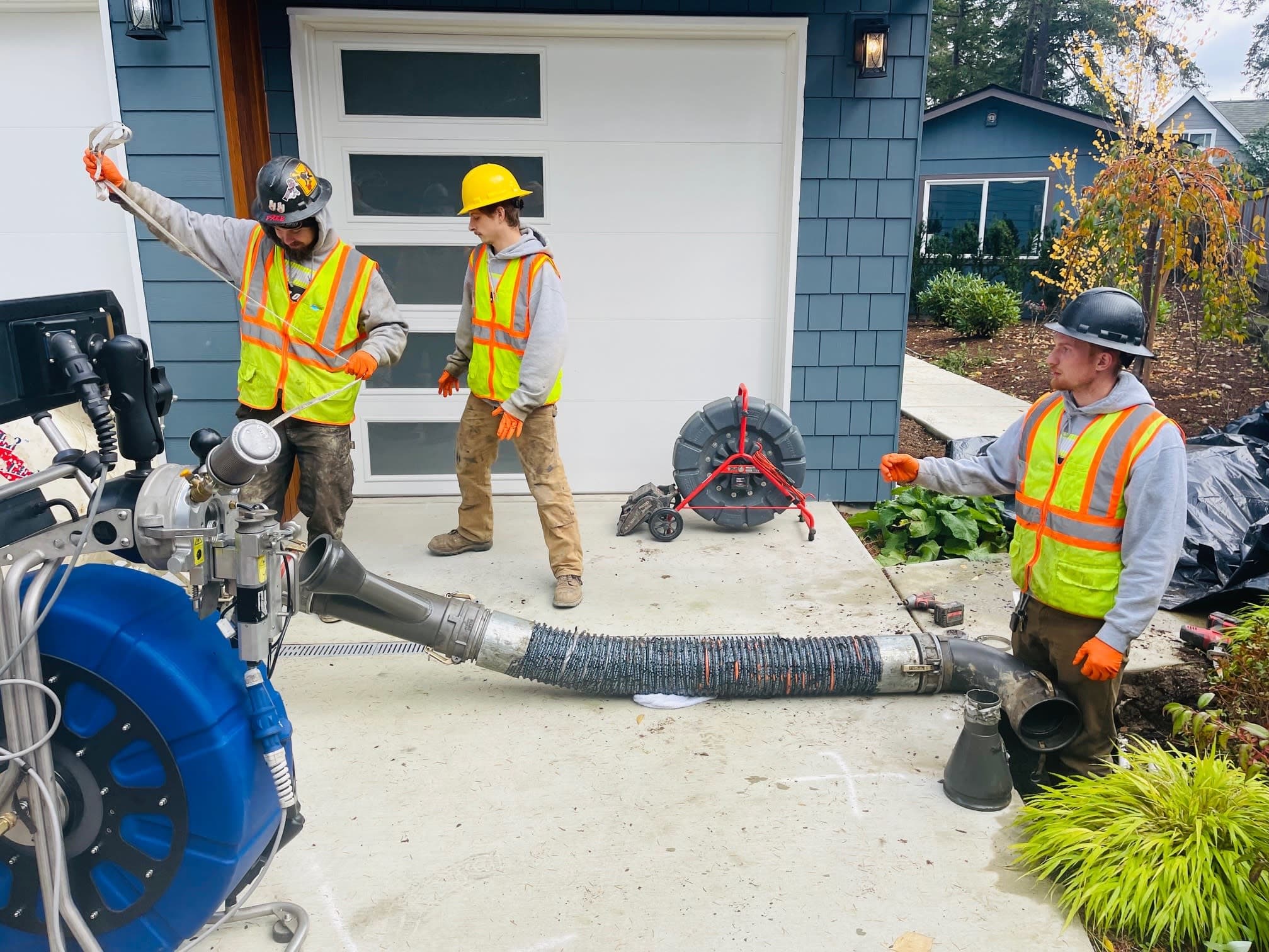 The Bob Oates crew on site during a sewer pipe lining procedure, above ground machine