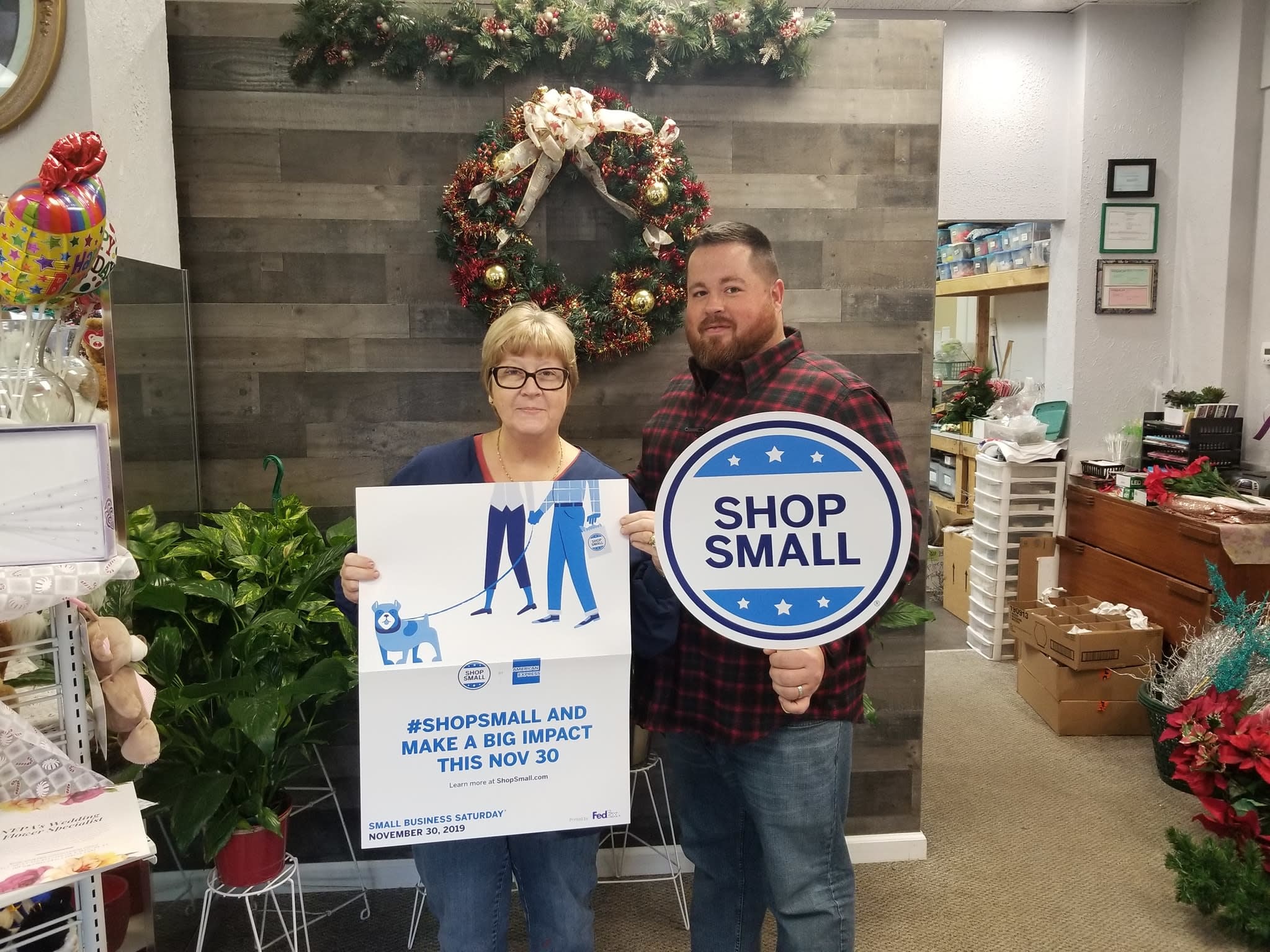 Anna & Shane from A&M floral posing with Small Business Signs