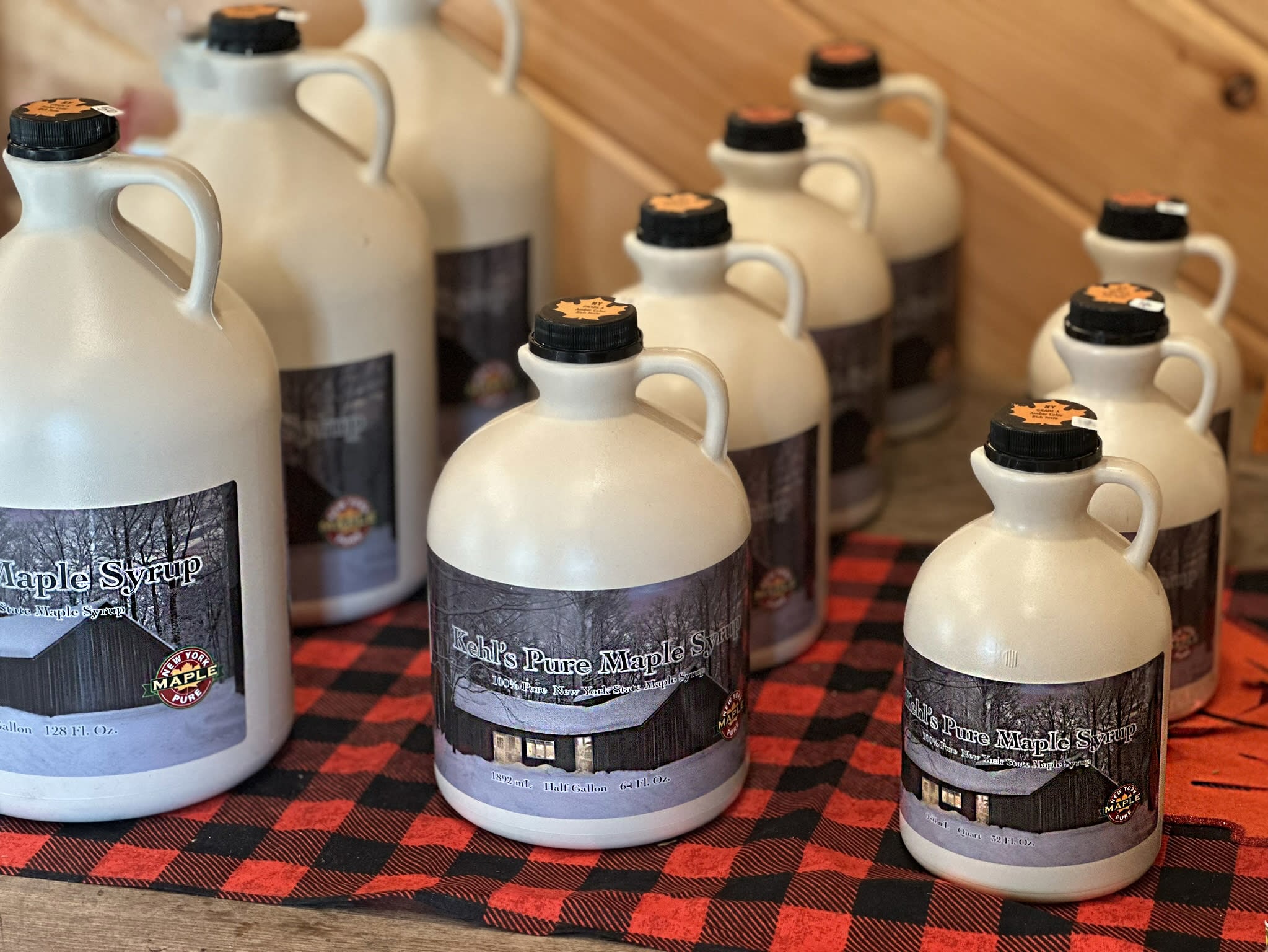 Photo of white plastic maple syrup bottles with the Kehl Maple logo