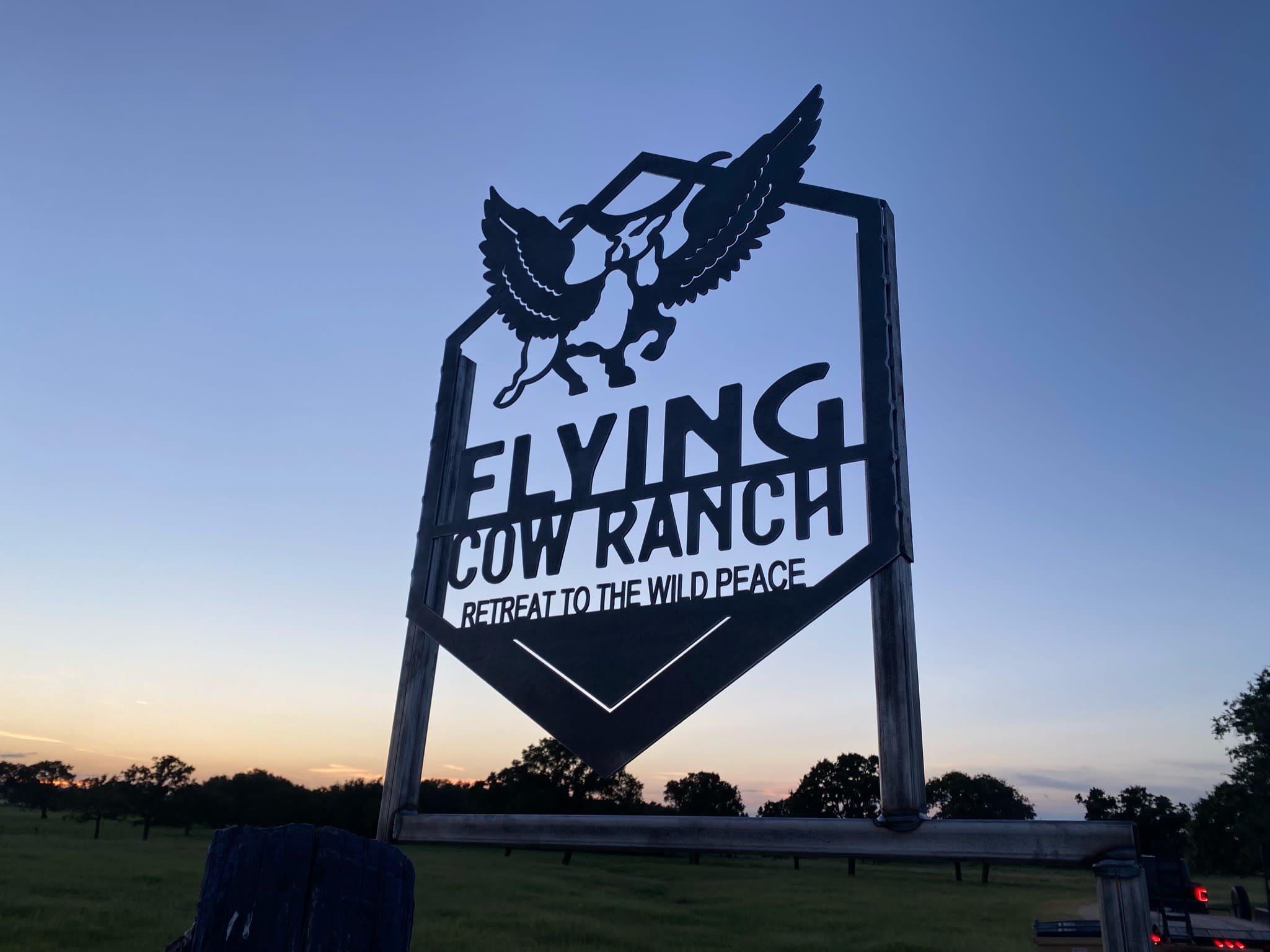 cutout sign against sunset