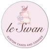 A beautifully decorated custom cake and matching cookies by Le Swan Custom Cakes & Cookies