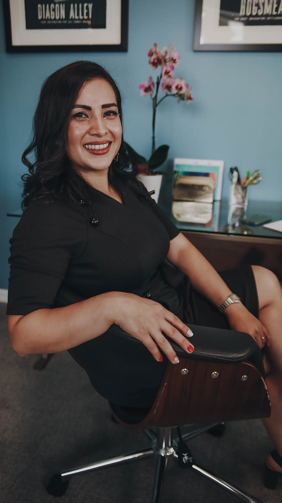 Ana Varona sitting at her desk