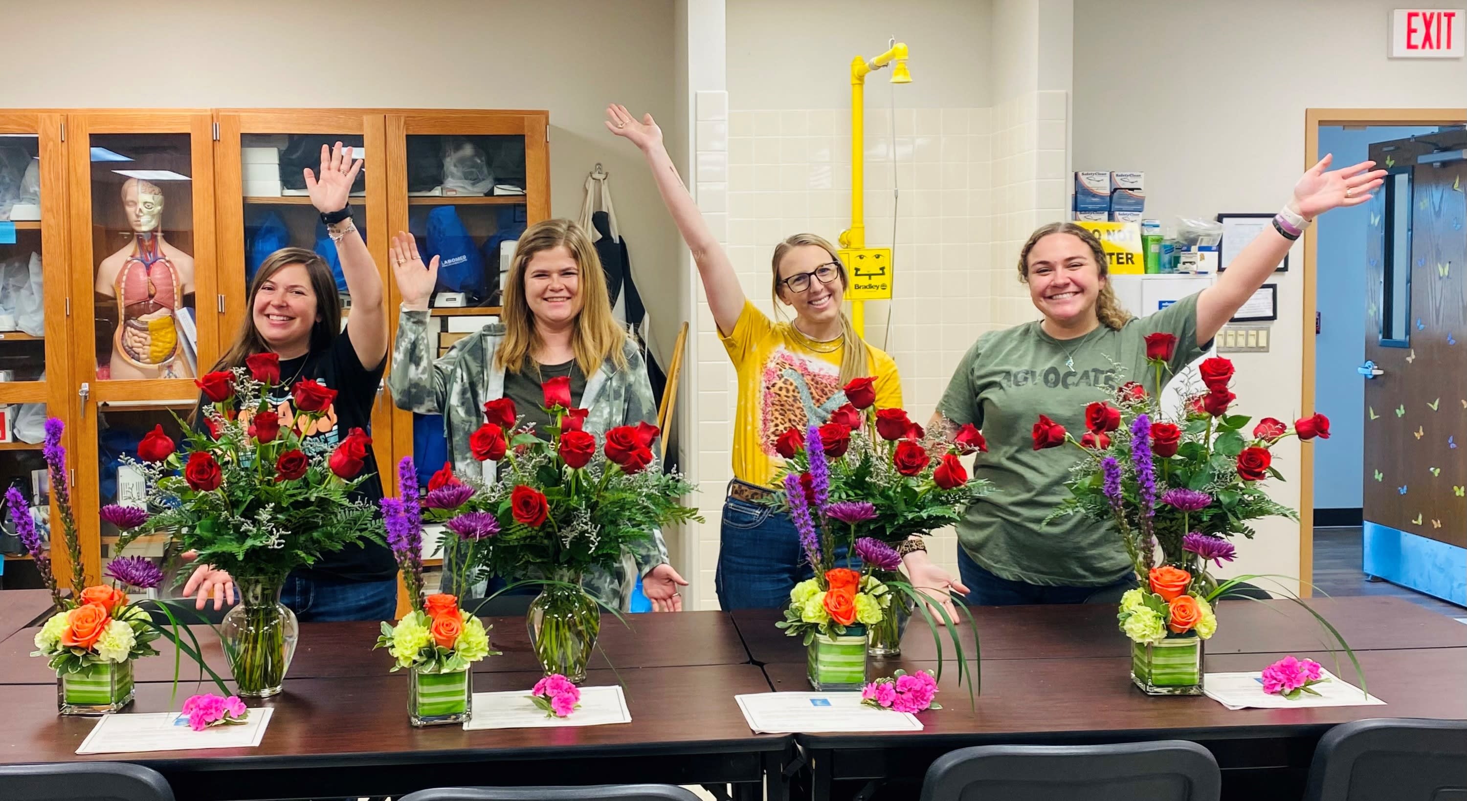 Group of smiling floral design teachers
