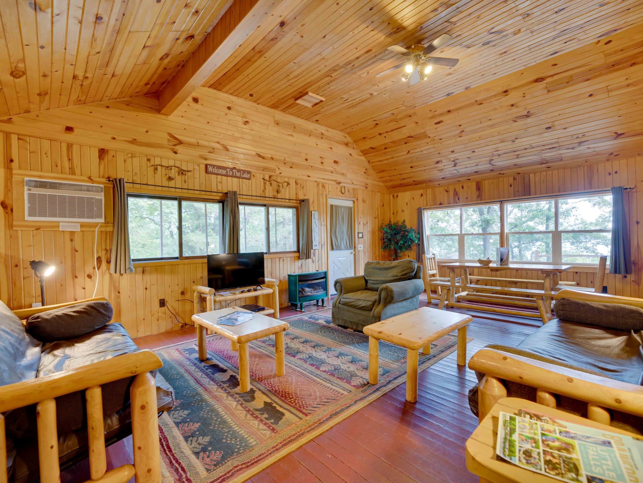 A beautiful knotty pine interior of a spacious living room of a 3BR cabin in the Brainerd Lakes Area