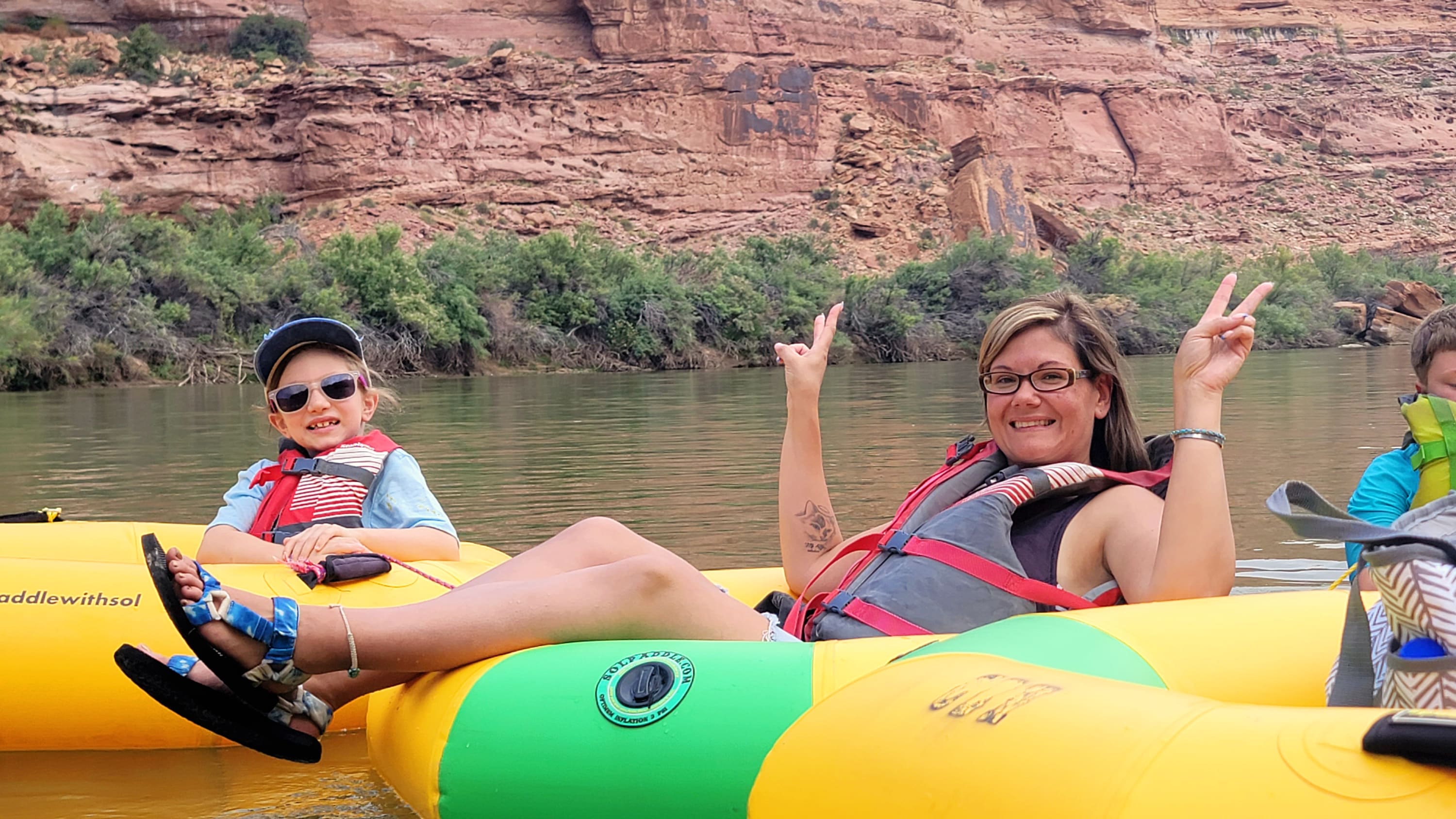 Guests floating in river tubes on a calm stretch of the Colorado River