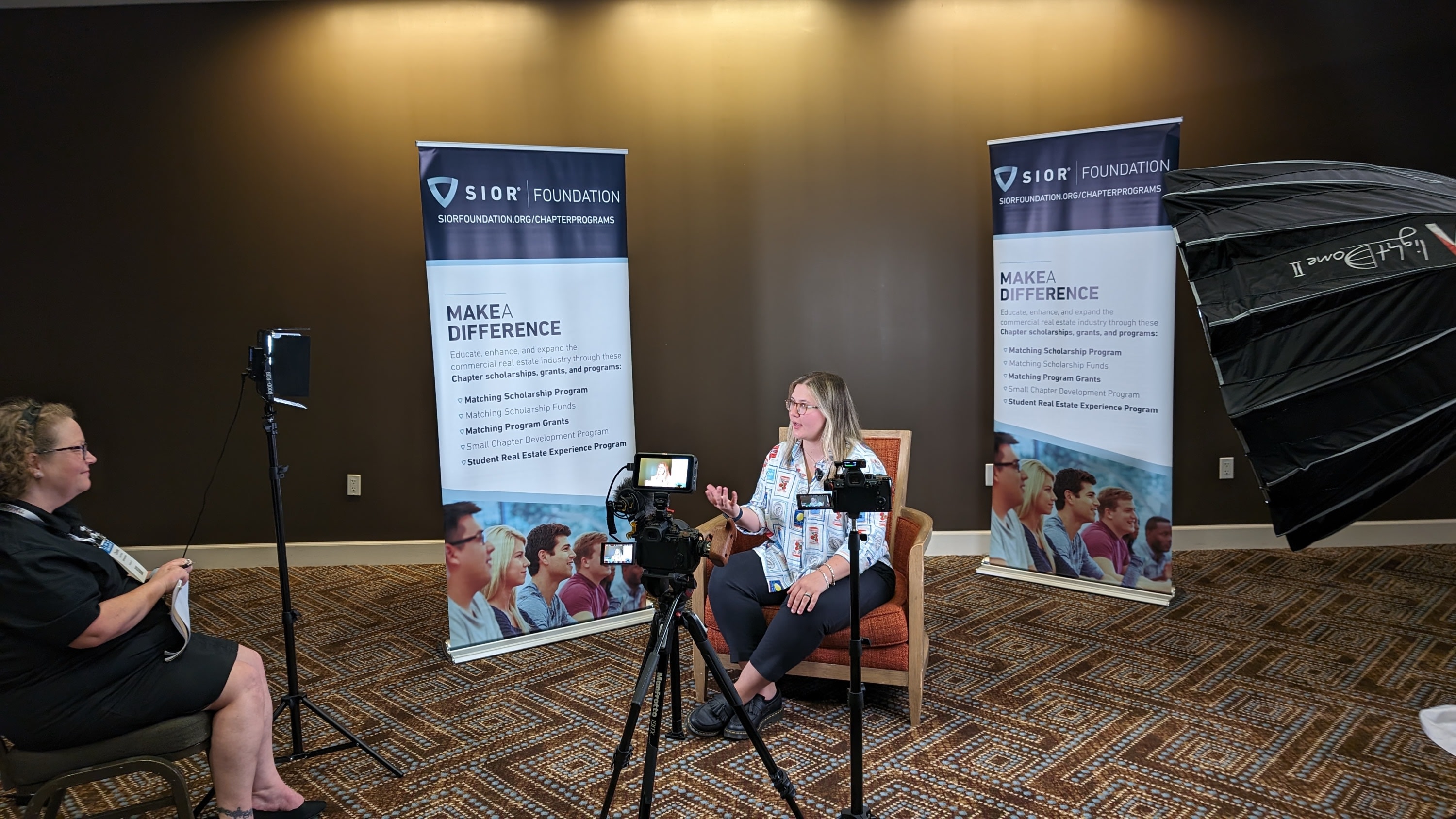 Pieter Jordaan filming a corporate promotional video with a professional camera setup