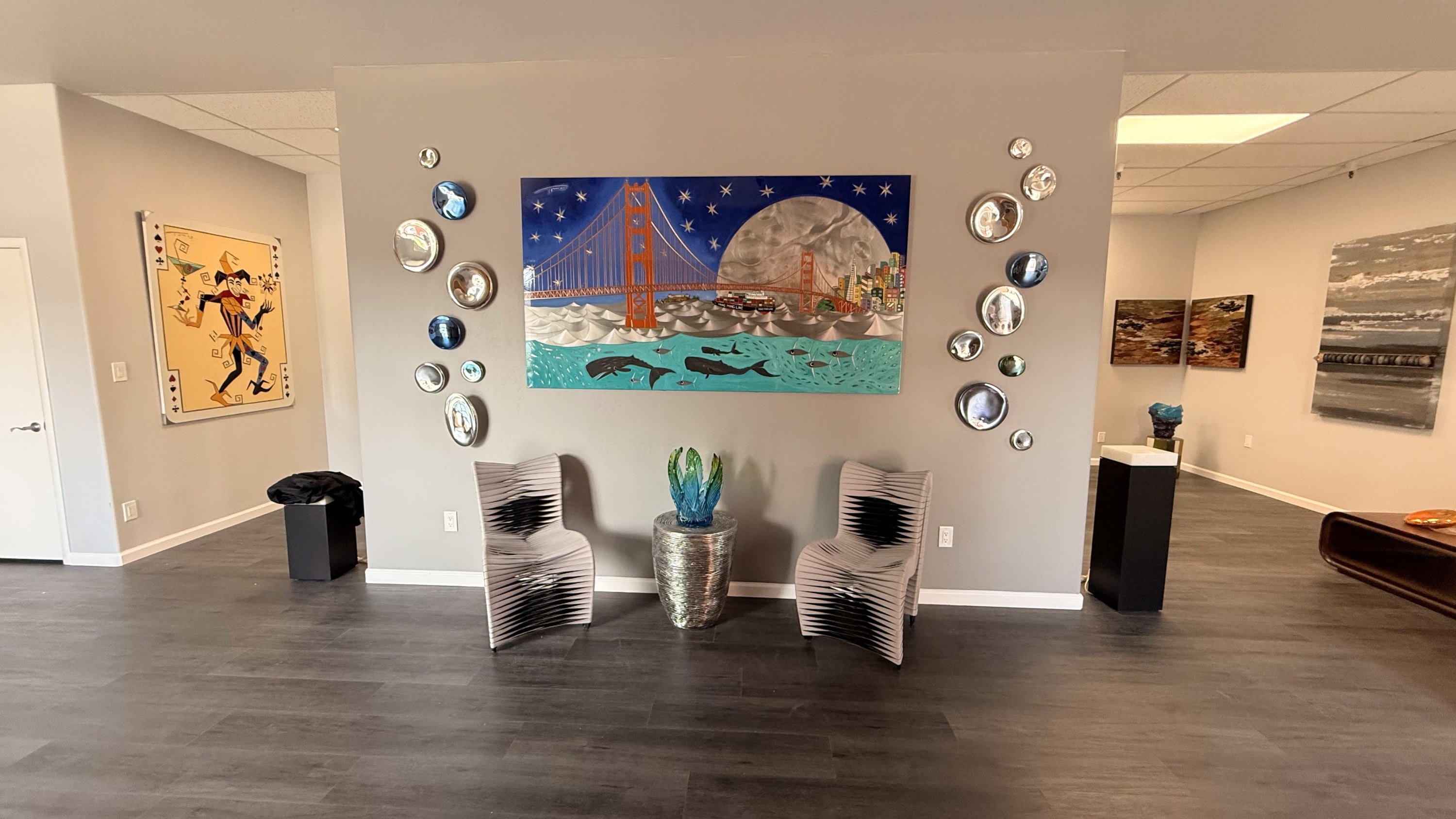 Fine art paintings by Tomas Panzarino and chairs by Phillips Collection