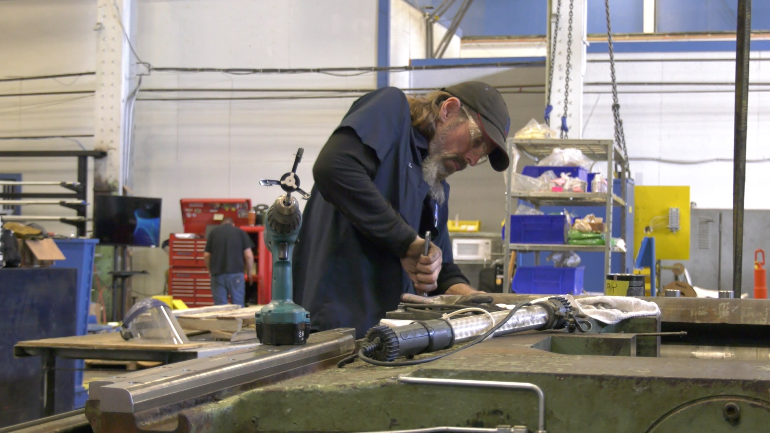 Mechanic assembling a Stanray Wheel Truing Machine