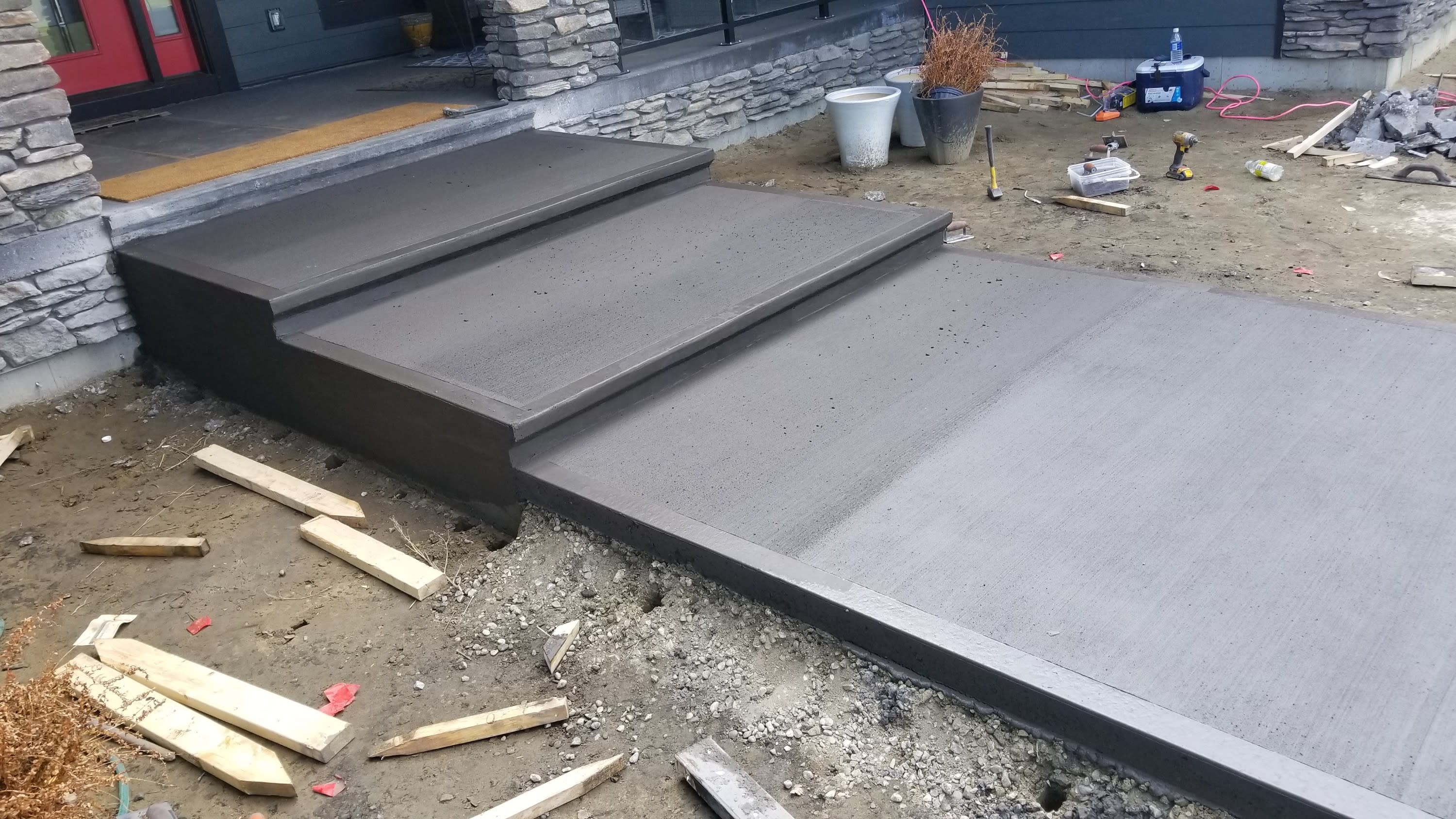 Concrete patio, driveway and sidewalk, forming, pouring and landscaping.