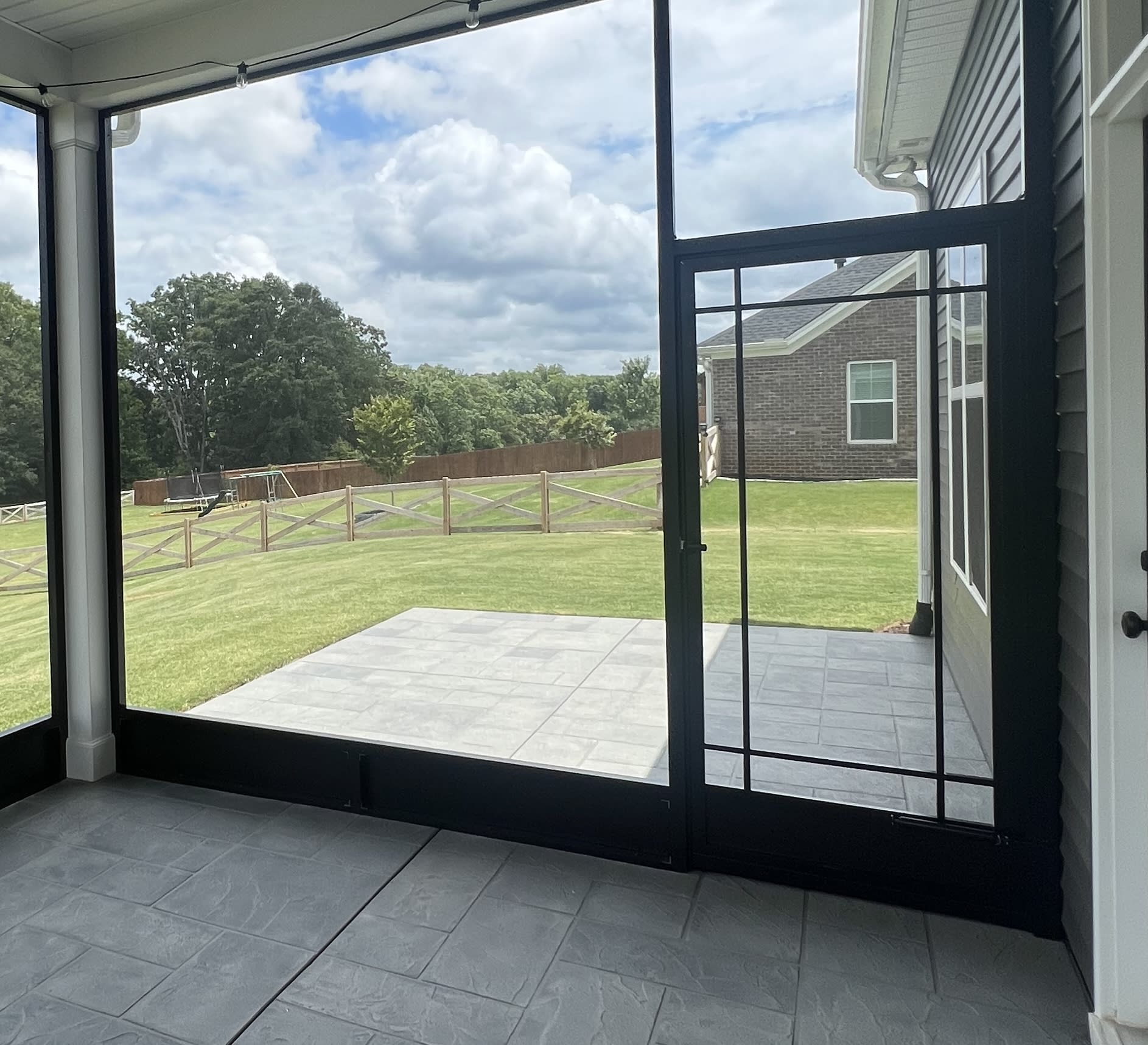 Patio Framed with Kick Plate Coil and Oak Park Screen Door