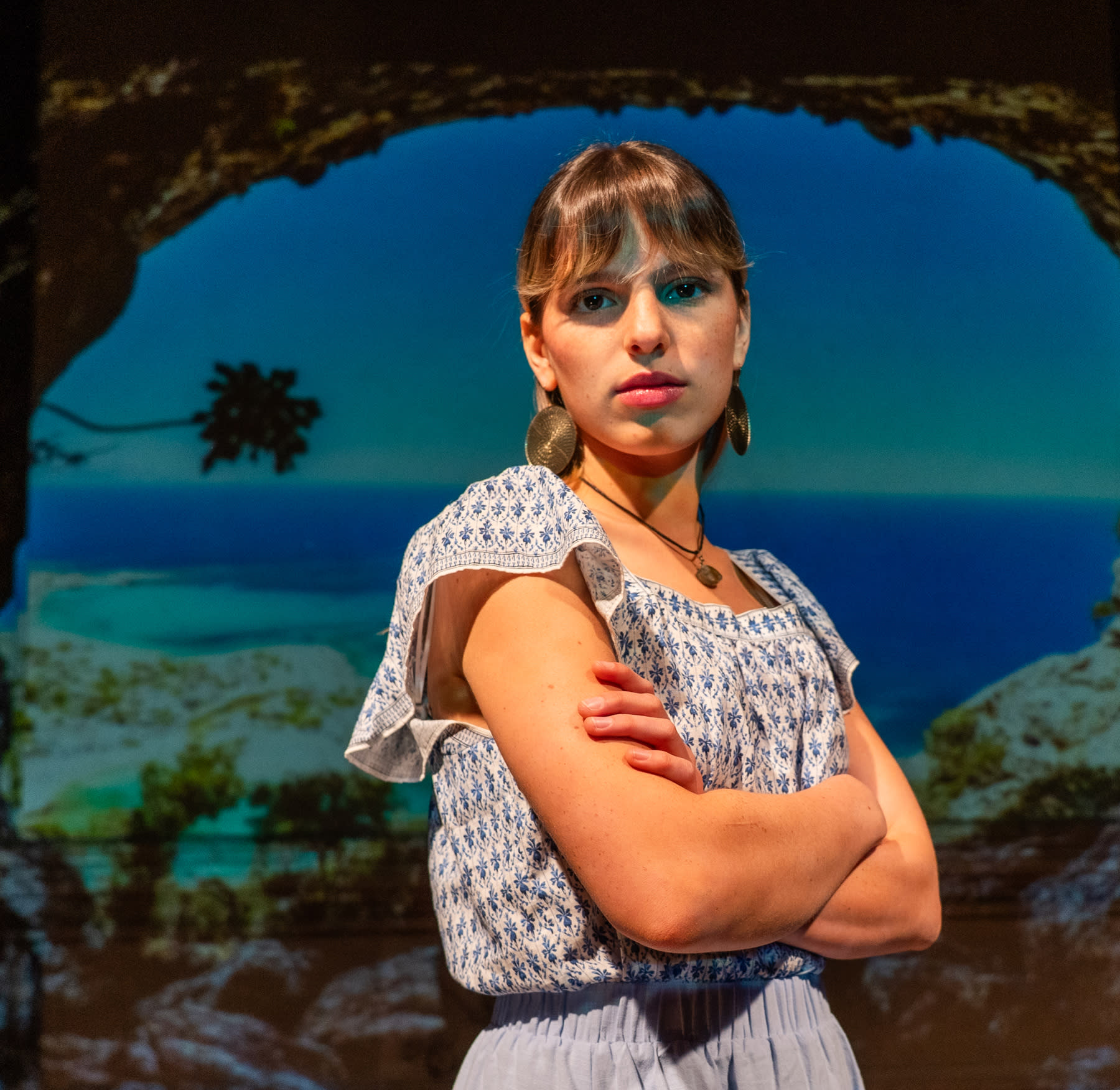 Kori, played by Liris Robles, is skeptical of the handsome castaway who's washed up on her island.