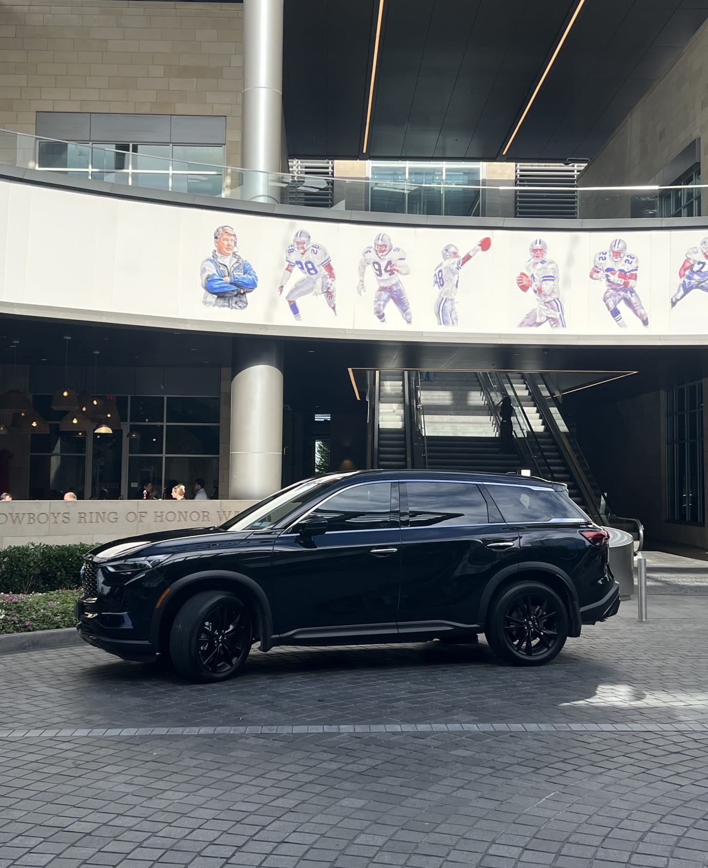 Blacked out QX60 in front of the Dallas Cowboys' Ring of Honor in Frisco, Texas.