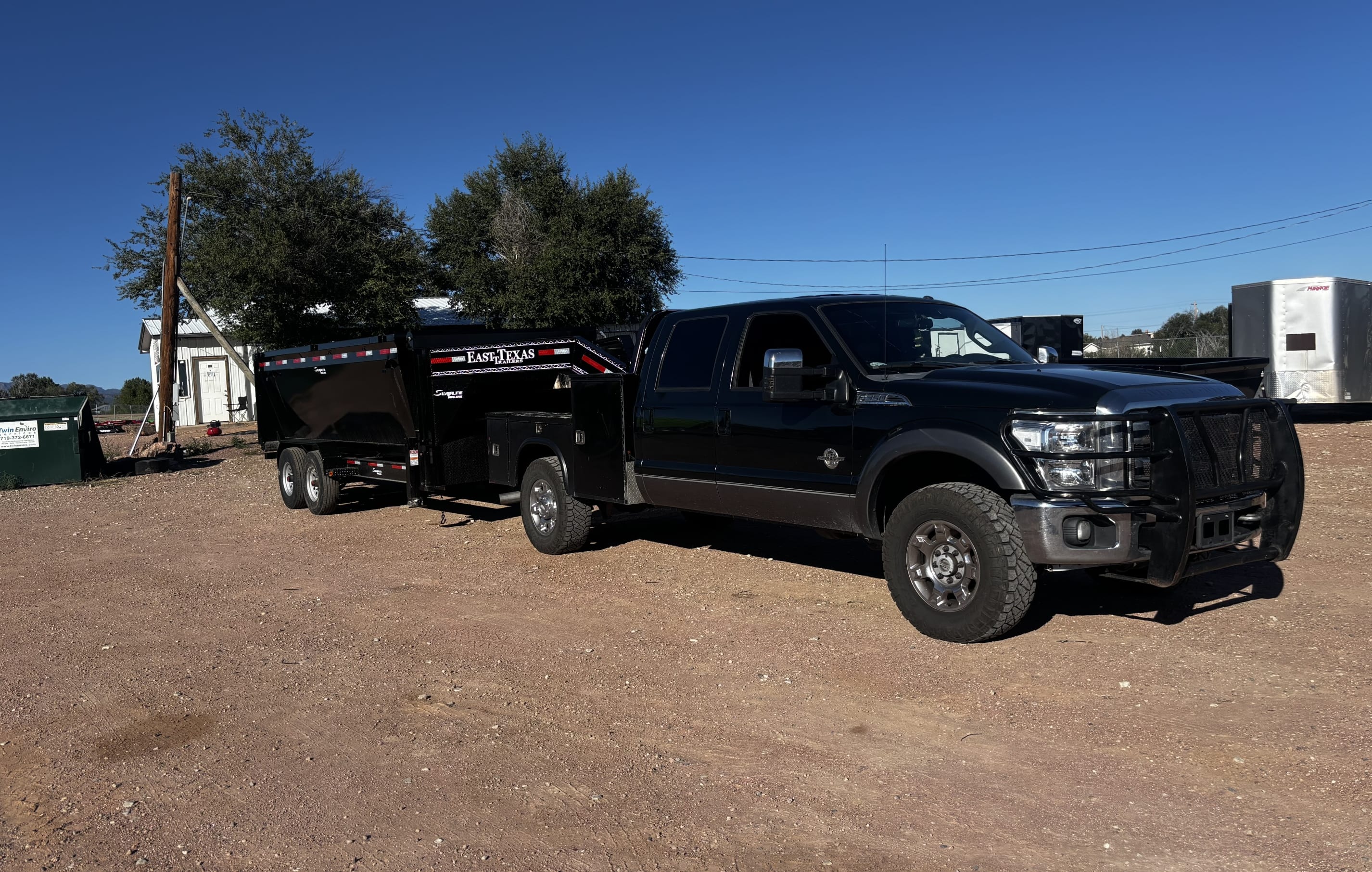 Vance Disposal truck parked at a Pueblo job site ready for junk removal service